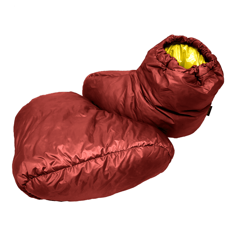 A pair of Ultralight down booties in Brick Red (shell) and Yellow (interior)